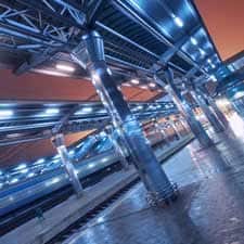 photo taken beneath the elevated train tracks at night